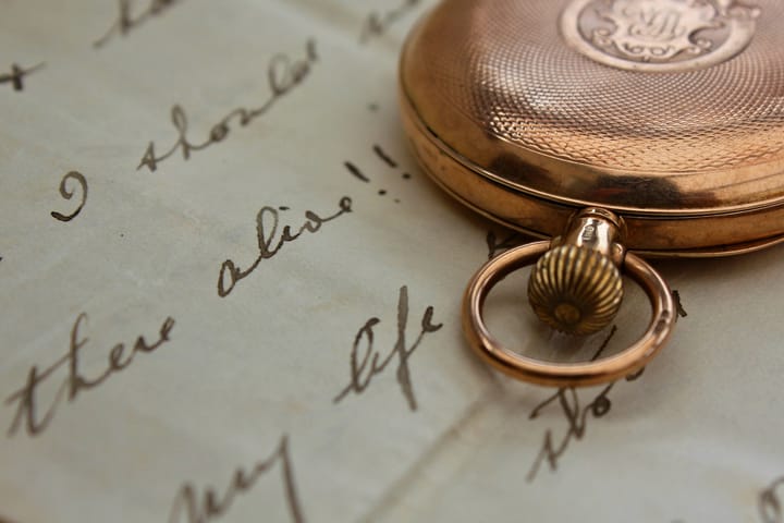 An old watch and a letter. By Kate#2112 on Flickr.